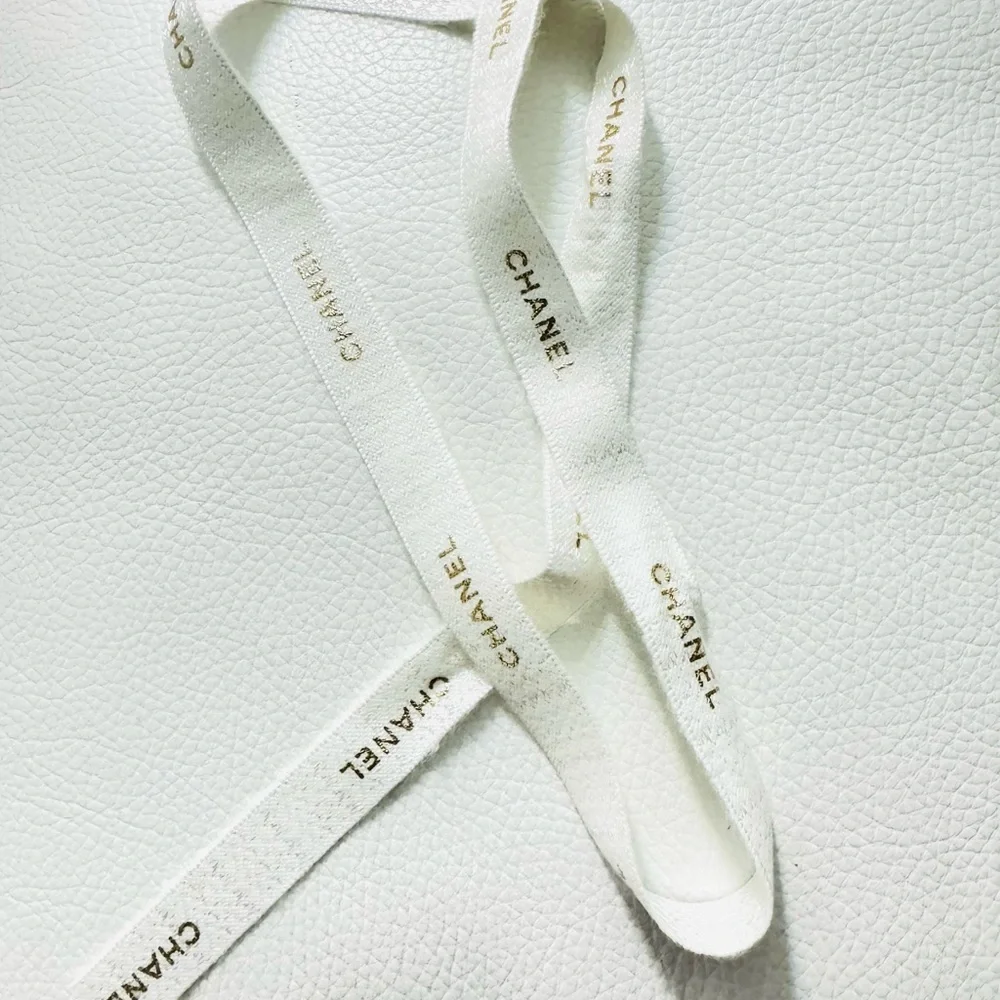 Chanel White Ribbon w gold font limited edition for holiday